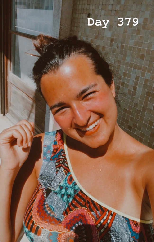 Girl in a bikini sunbathing on the balcony